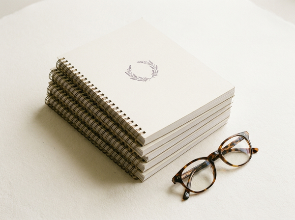 Full Script Library workbook stack with glasses
