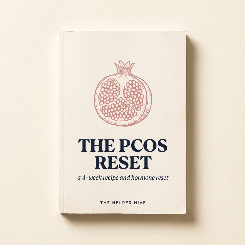 The PCOS Reset — workbook covers with pomegranate motif in dusty rose