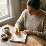 Cycle Syncing Kit - lifestyle: woman journaling with highlighter at breakfast table
